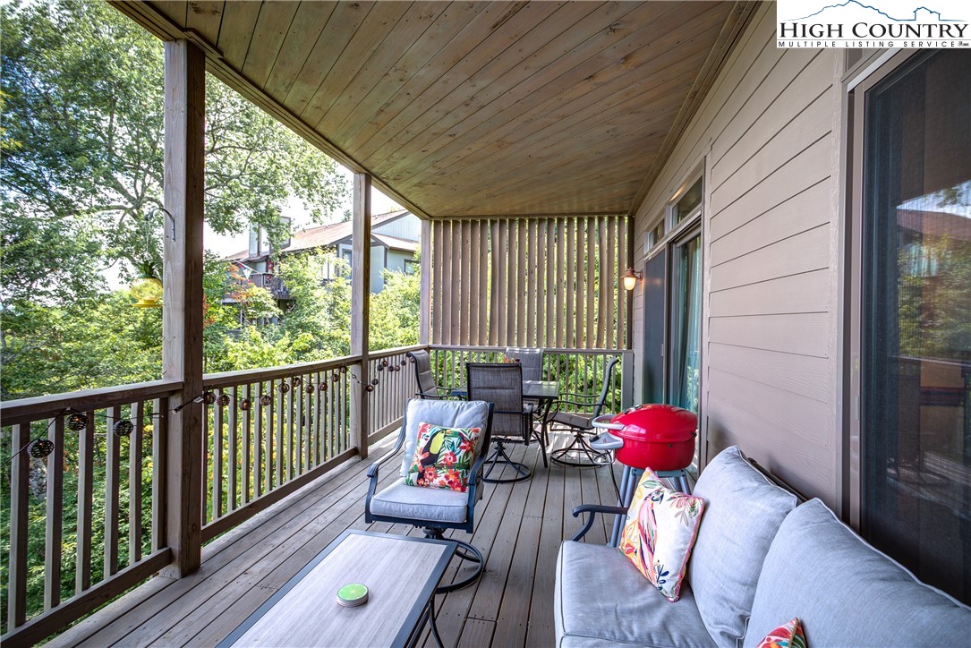 202 Pleasant View, Unit 9D Sugar Mountain, NC 28604 - Photo 16 of 48 a view of deck with furniture and garden