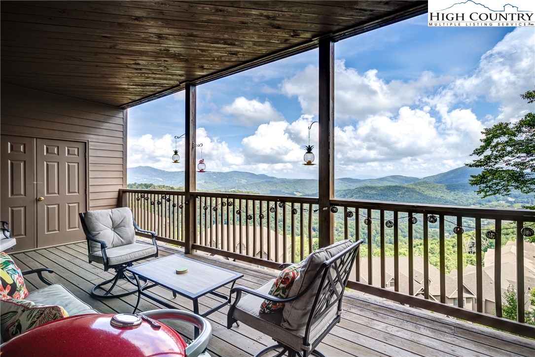 202 Pleasant View, Unit 9D Sugar Mountain, NC 28604 - Photo 17 of 48 a view of a chairs in balcony