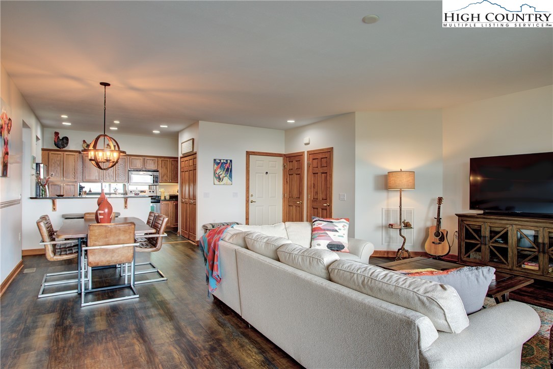 202 Pleasant View, Unit 9D Sugar Mountain, NC 28604 - Photo 20 of 48 a living room with furniture and a flat screen tv