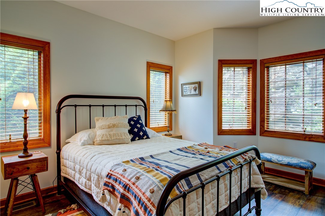 202 Pleasant View, Unit 9D Sugar Mountain, NC 28604 - Photo 35 of 48 a bedroom with a bed and a window