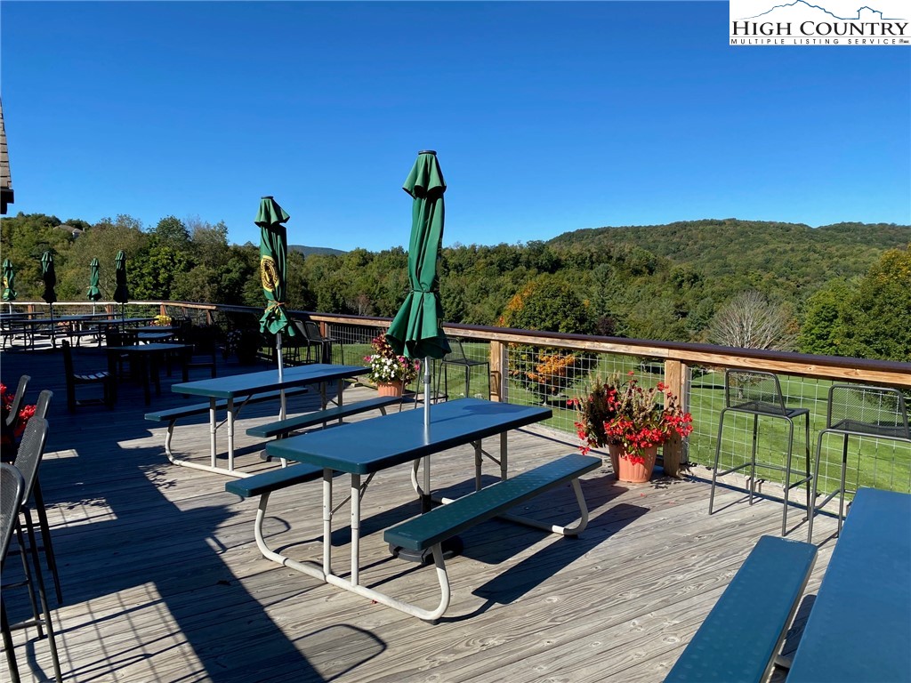 202 Pleasant View, Unit 9D Sugar Mountain, NC 28604 - Photo 44 of 48 a view of a balcony with chairs