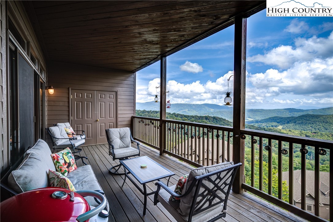 202 Pleasant View, Unit 9D Sugar Mountain, NC 28604 - Photo 7 of 48 a roof deck with couches and potted plants