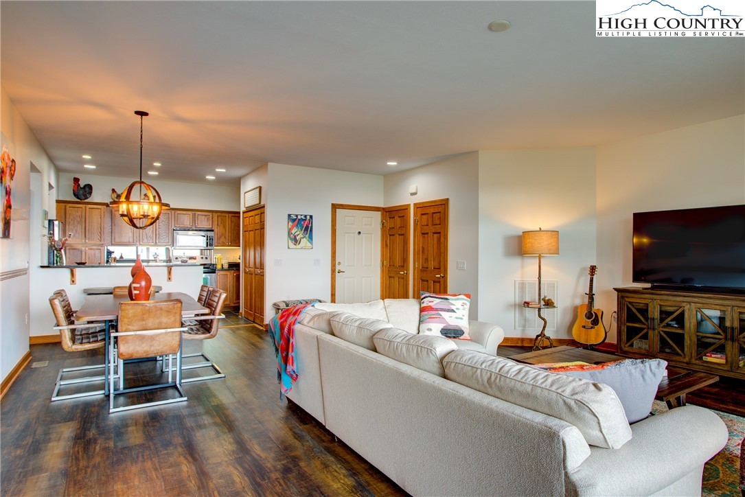 202 Pleasant View, Unit 9D Sugar Mountain, NC 28604 - Photo 10 of 48 a living room with furniture and a flat screen tv