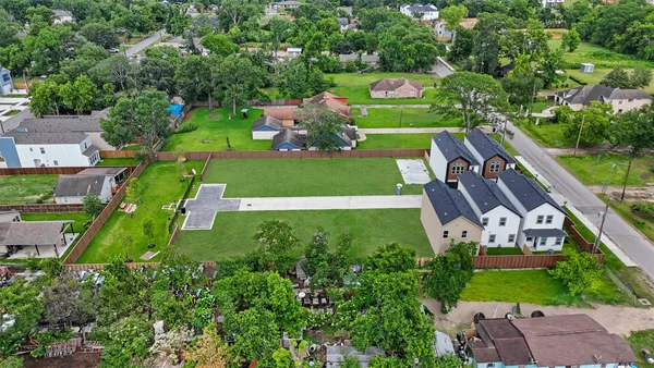 a view of a backyard with a swimming pool