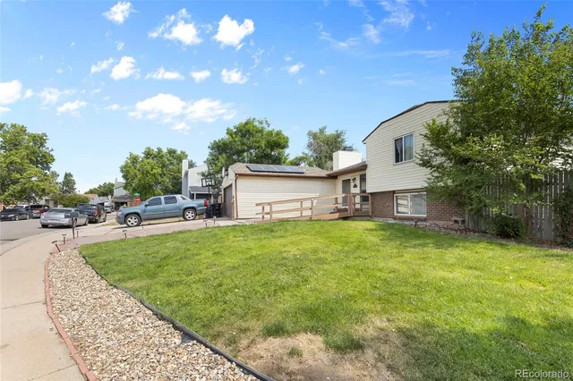 a view of a backyard with sitting area