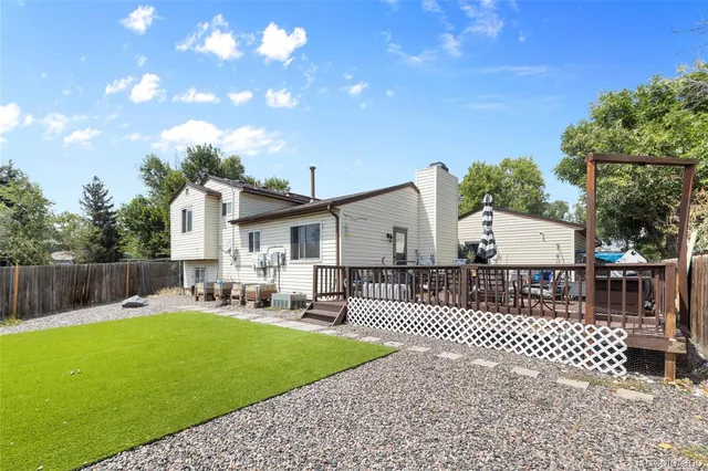 a front view of a house with garden and patio