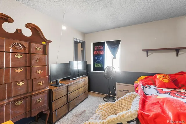 a bedroom with a bed and furniture