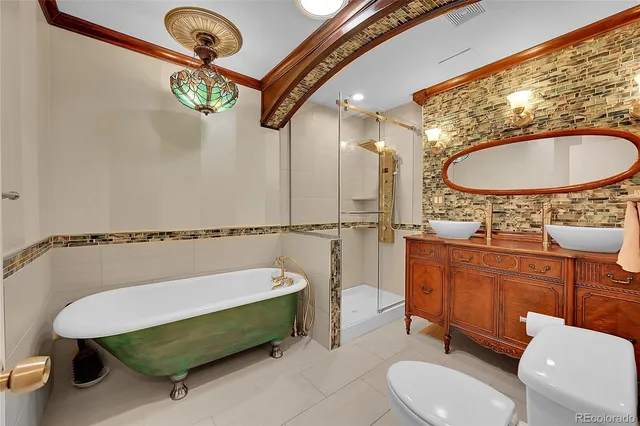 a bathroom with a sink a toilet and tub