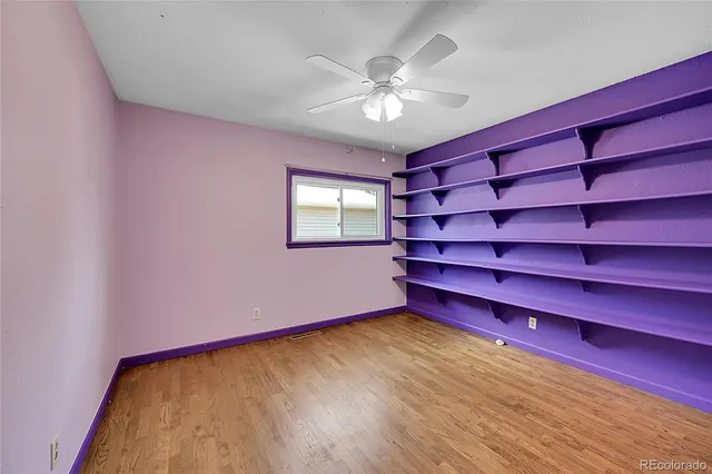 a view of a room with window and wooden floor
