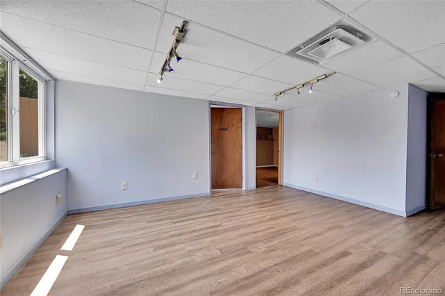 a view of a livingroom with wooden floor