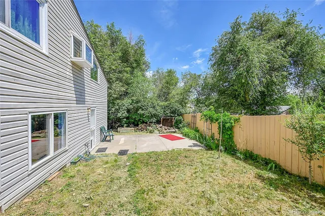 a view of a wooden deck and a yard