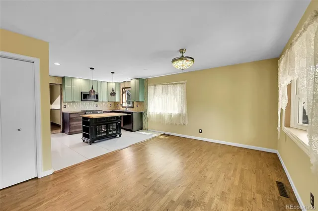 a view of kitchen with furniture and window