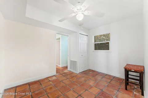 a view of a street with big trees