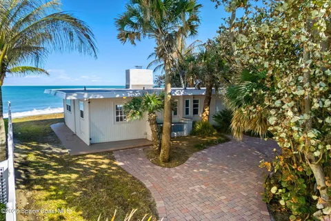 a spacious bathroom with a double vanity sink a mirror and a