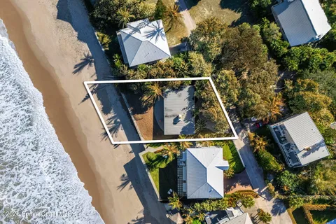 a view of a house with a tree