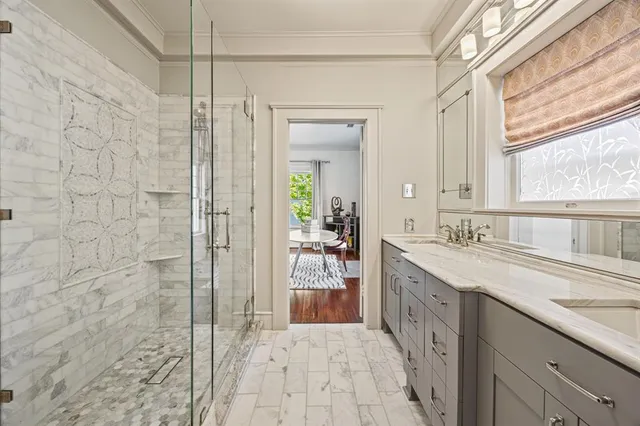 a large white kitchen with a large window