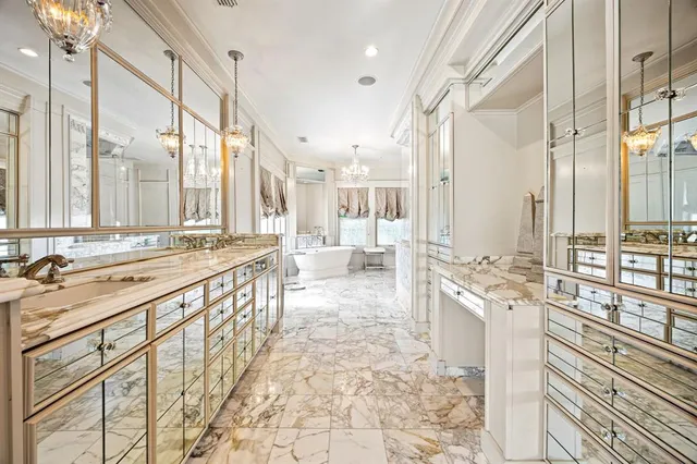 a bathroom with a glass shower door