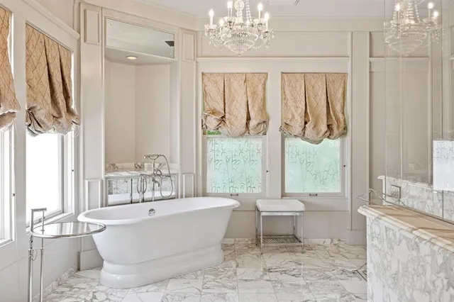 a view of a patio with table and chairs wooden floor and fence