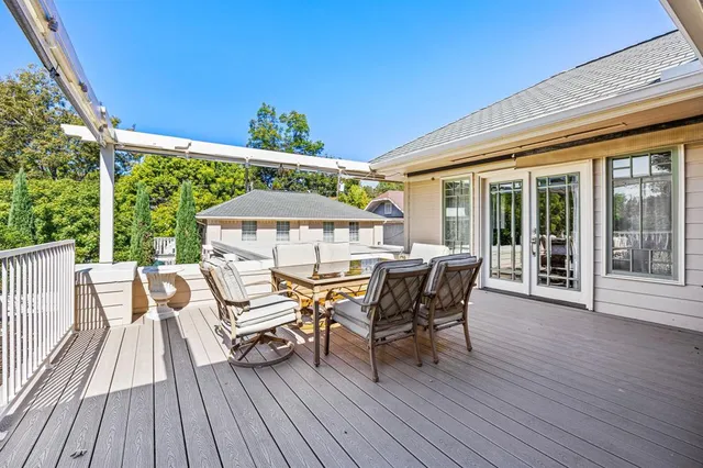 a view of a patio with table and chairs