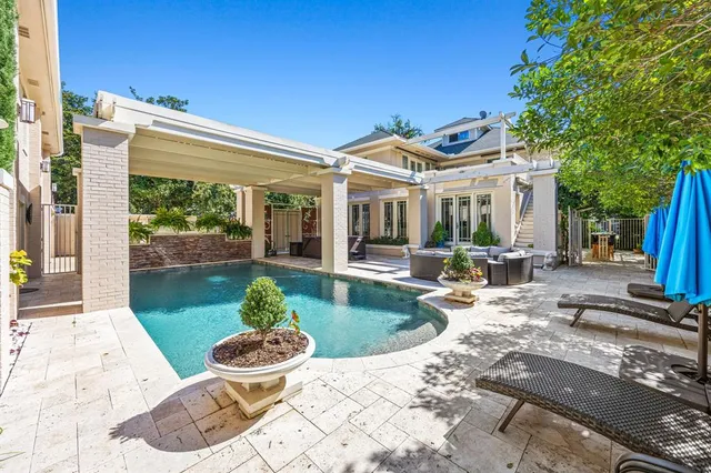 a house view with a sitting space and garden space