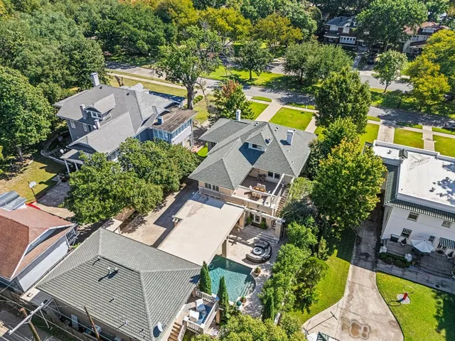 an aerial view of residential houses with city view