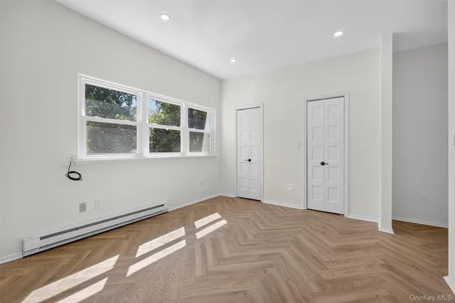 a view of empty room with windows