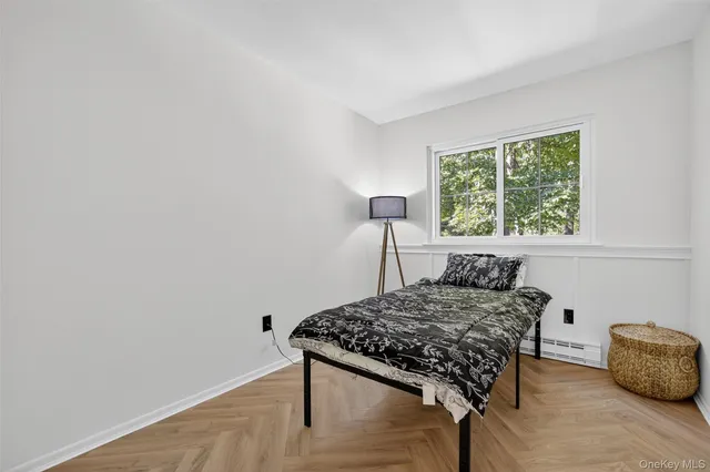 a bedroom with a bed and a table in it