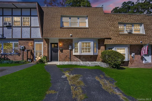 a picture of a bench in front of a wall