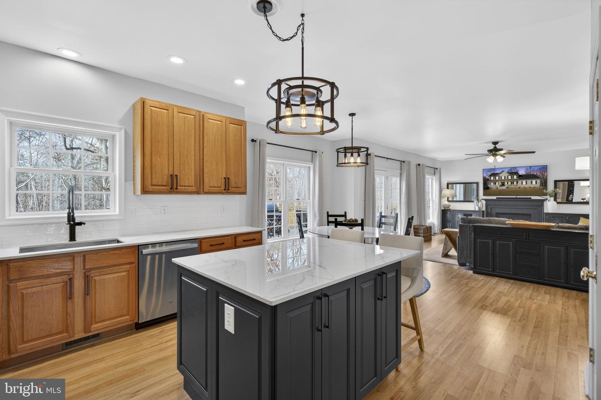 23 Richmond Road Castleton, VA 22716 - Photo 14 of 46 a kitchen with a center island wooden floor and a center island