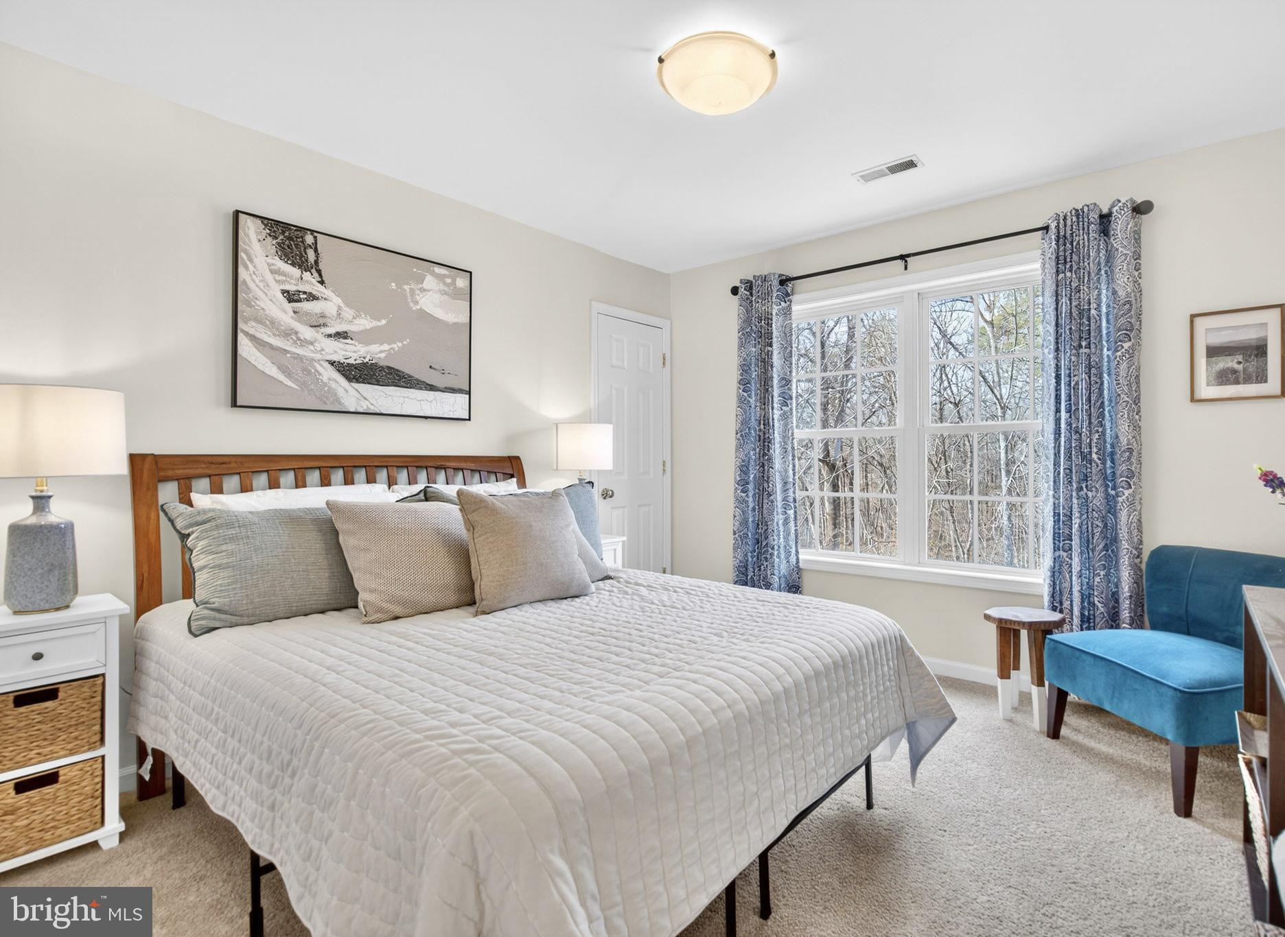 23 Richmond Road Castleton, VA 22716 - Photo 20 of 46 a bedroom with bed and a couch