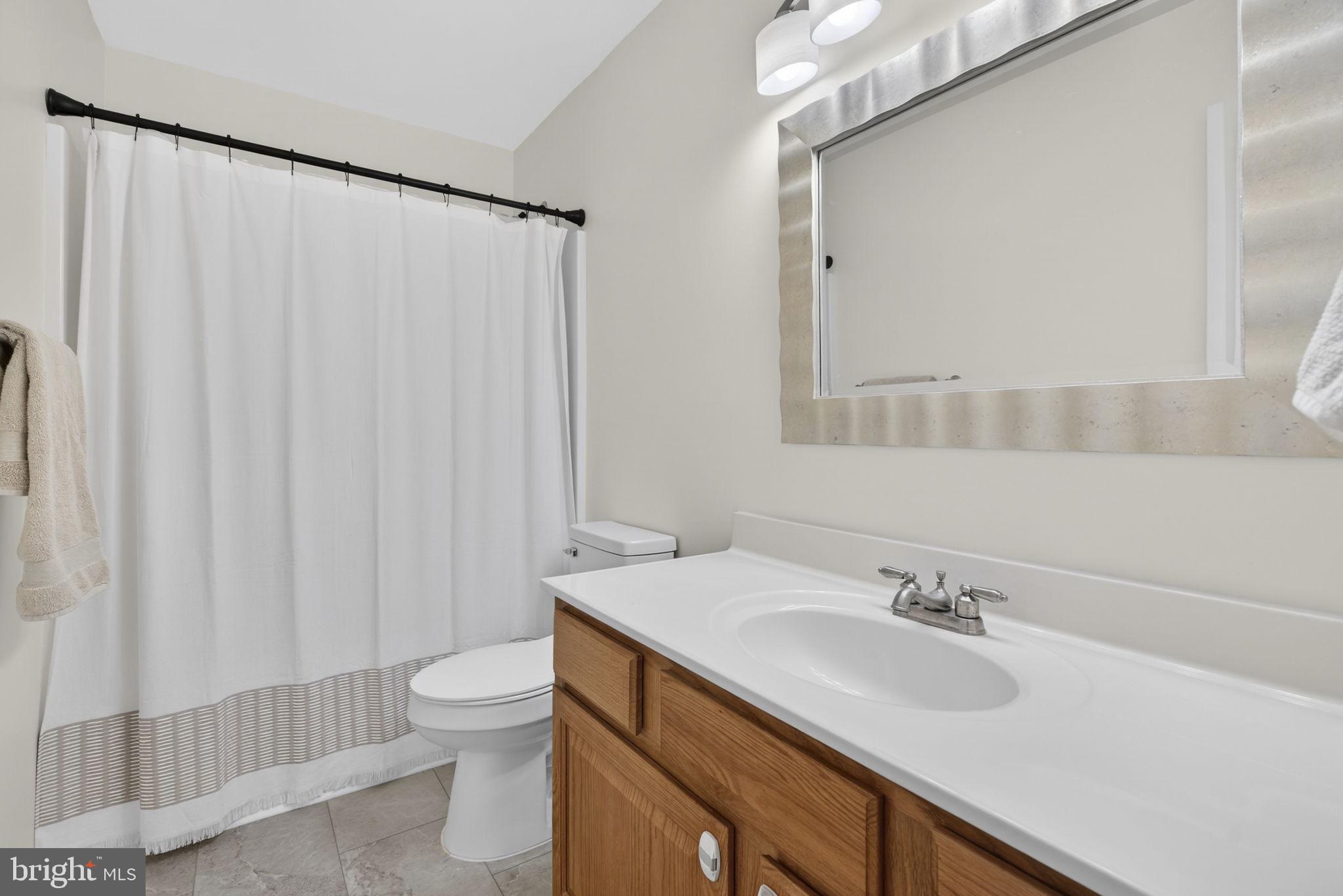 23 Richmond Road Castleton, VA 22716 - Photo 22 of 46 a bathroom with a sink toilet and shower