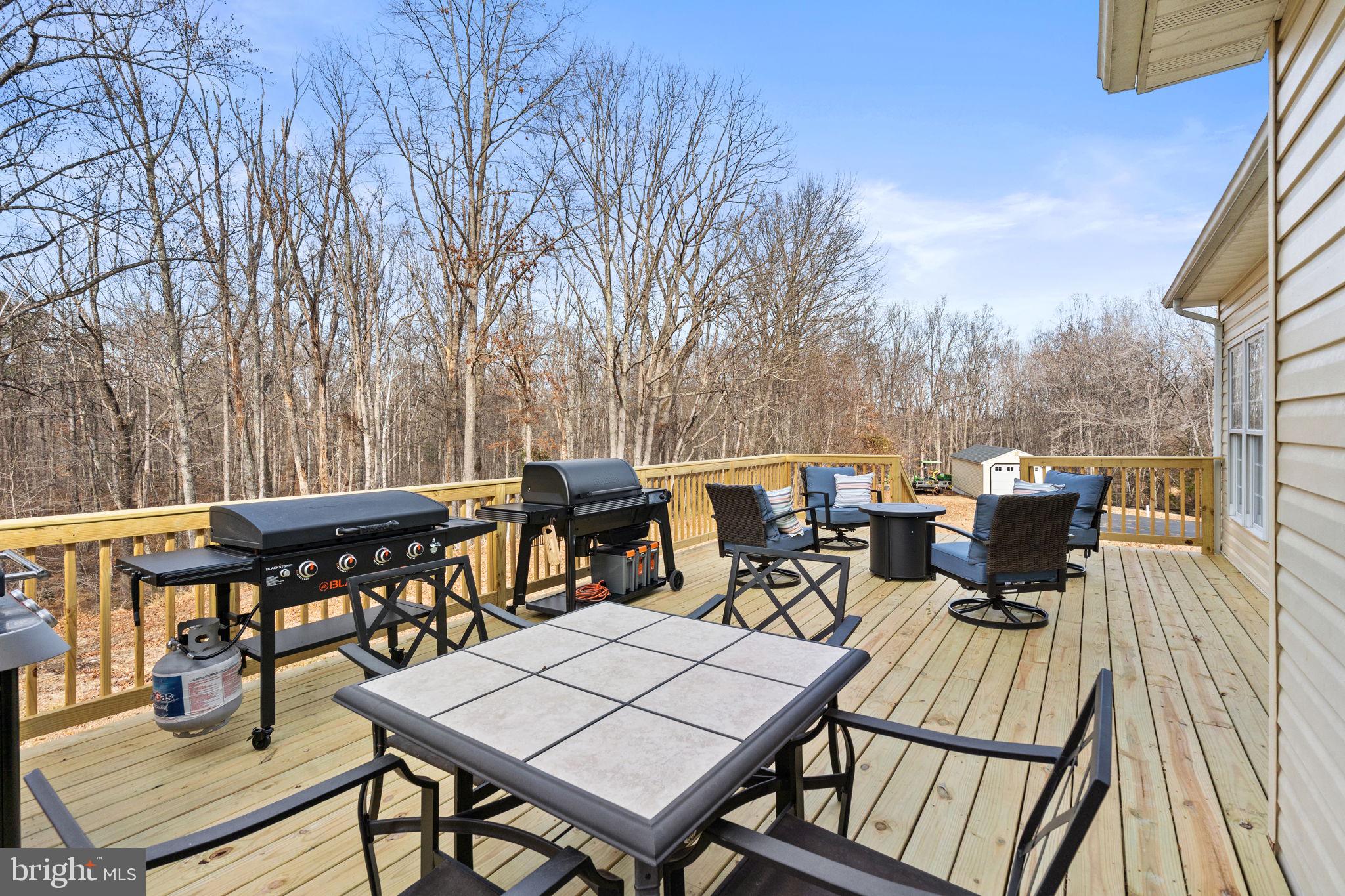 23 Richmond Road Castleton, VA 22716 - Photo 32 of 46 a view of a dinning tables and chairs on the roof deck