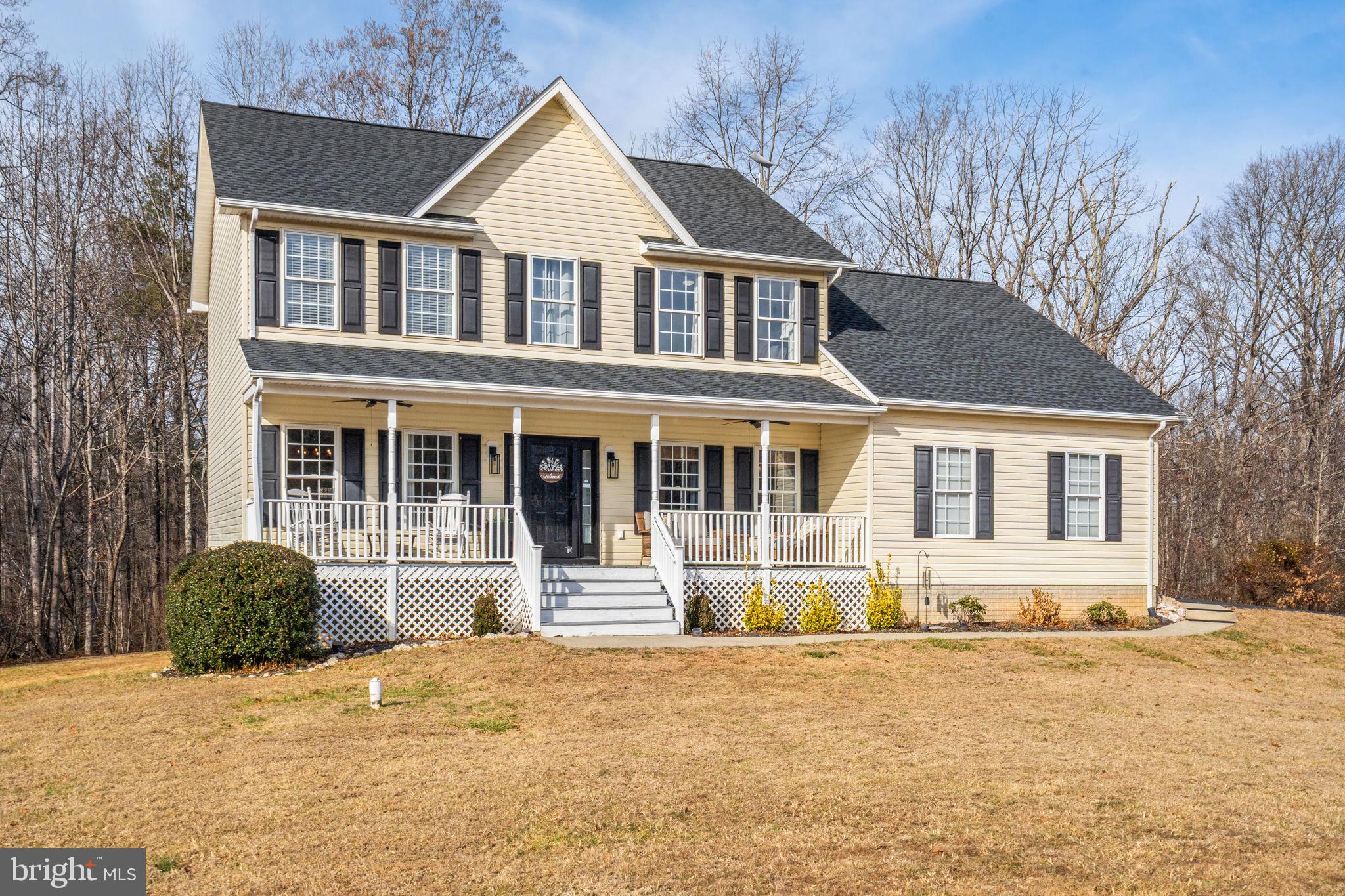 23 Richmond Road Castleton, VA 22716 - Photo 39 of 46 a front view of a house with a yard covered with snow and trees