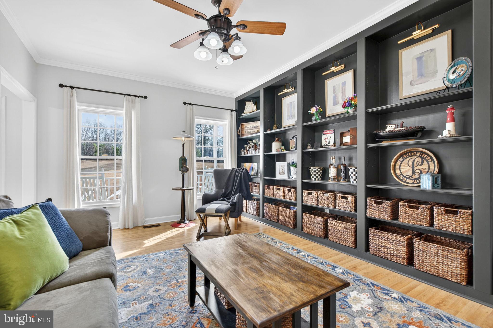 23 Richmond Road Castleton, VA 22716 - Photo 4 of 46 a living room with furniture a bookshelf and a window