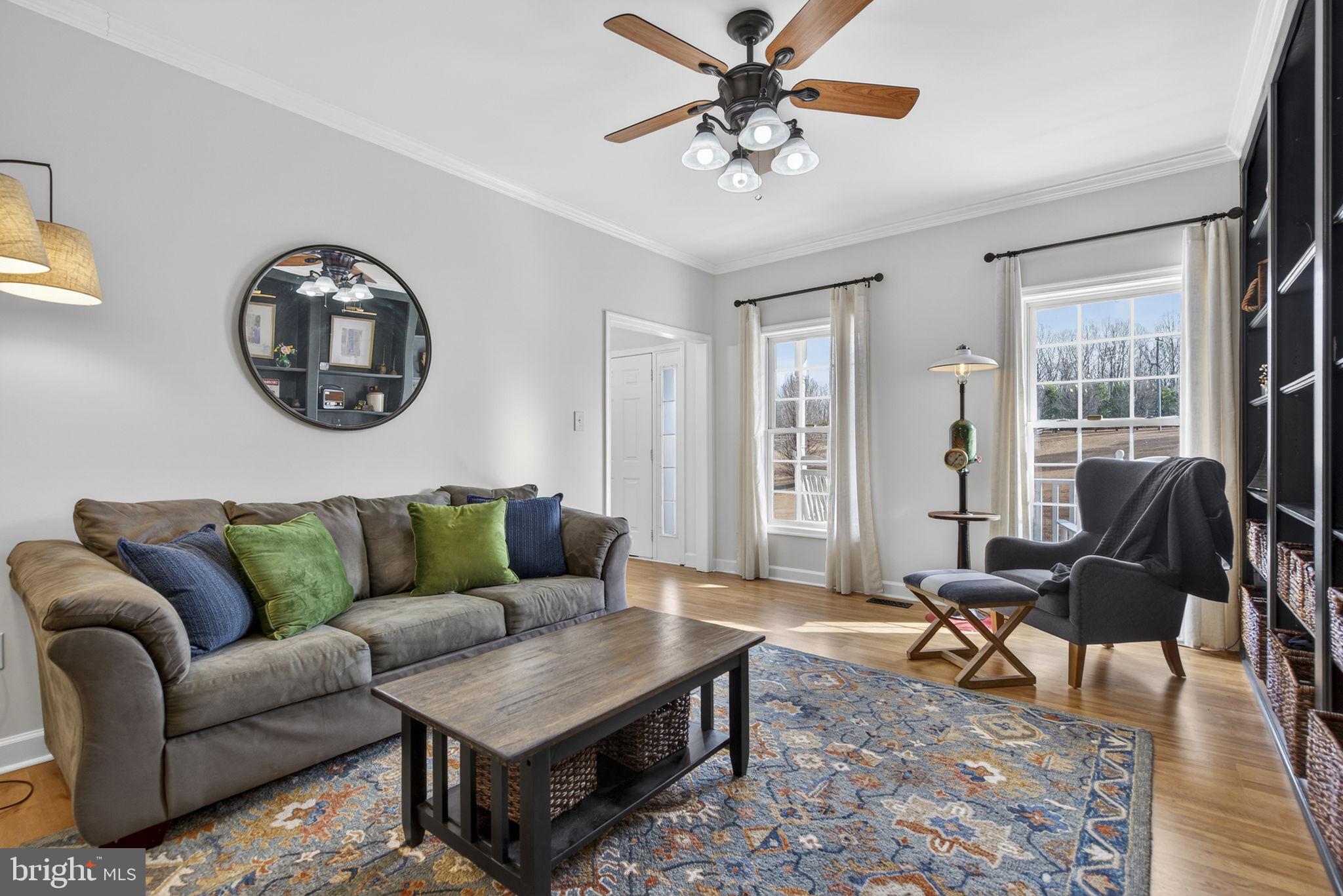 23 Richmond Road Castleton, VA 22716 - Photo 10 of 46 a living room with furniture and a large window