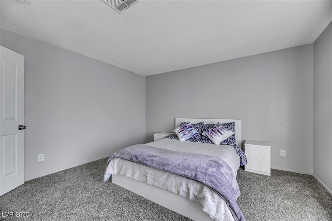 2907 Rio Sonora Court Henderson, NV 89074 - Photo 27 of 35 Carpeted bedroom with baseboards