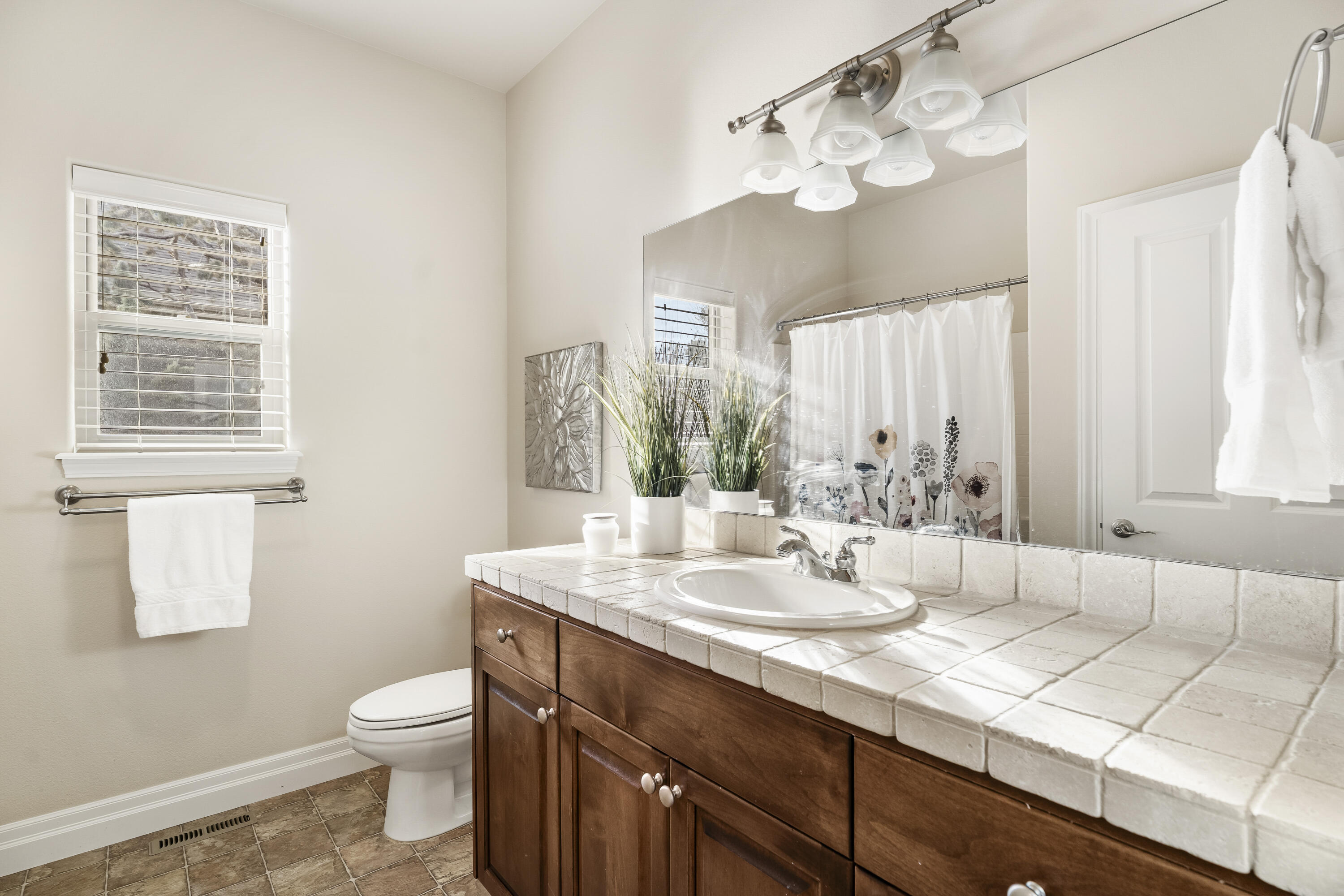 784 Ribbon Falls Road Redmond, OR 97756 - Photo 15 of 79 a bathroom with a sink vanity granite and toilet