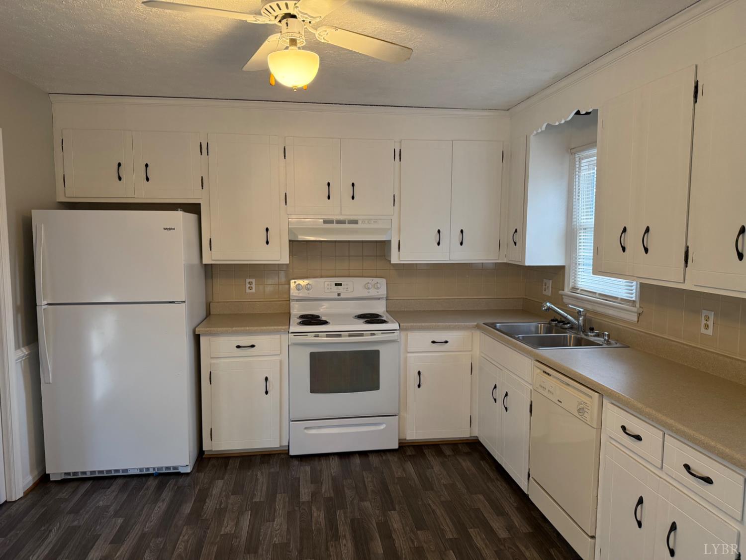 112 Wooldridge Circle Lynchburg, VA 24502 - Photo 4 of 29 a kitchen with cabinets stainless steel appliances and wooden floor