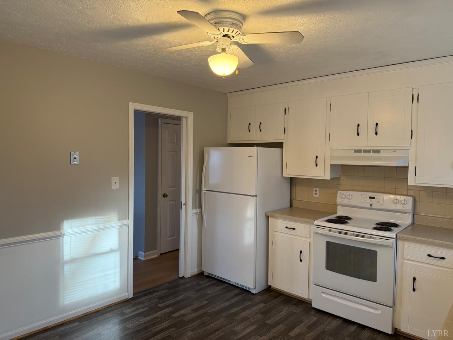 112 Wooldridge Circle Lynchburg, VA 24502 - Photo 5 of 29 a kitchen with white cabinets and white appliances
