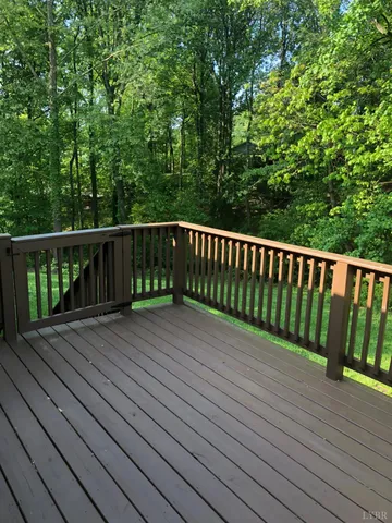 a balcony with wooden floor