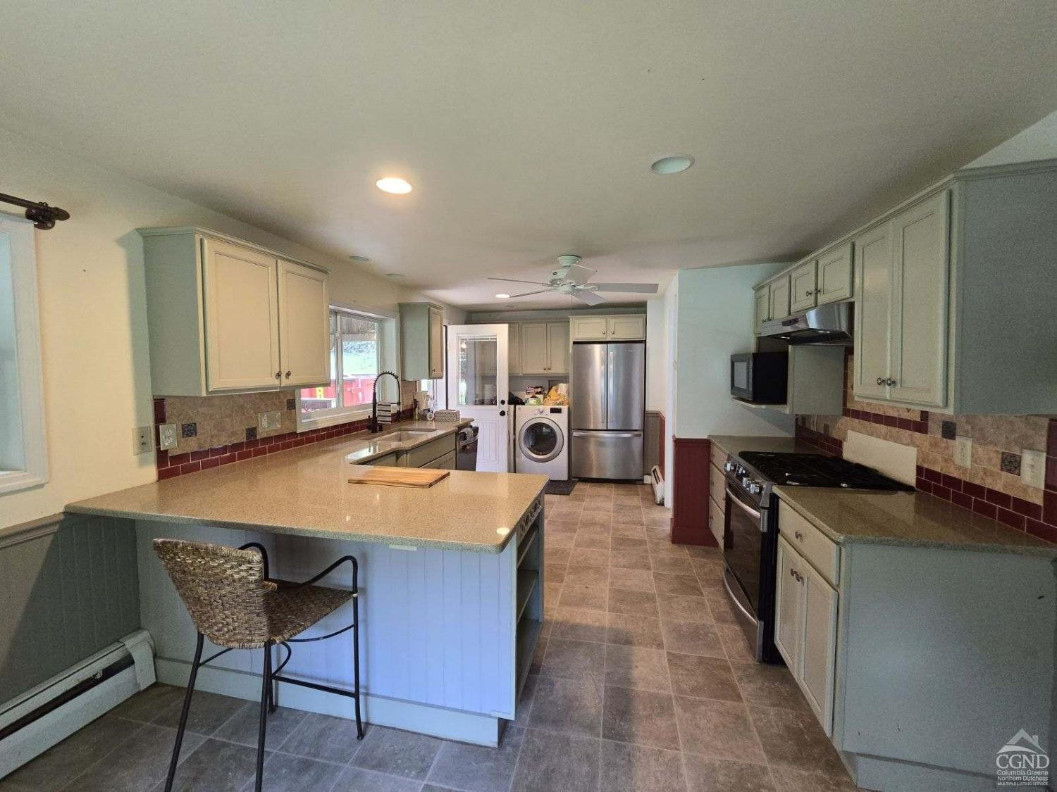 257 Saybrook Valley Road Durham, NY 12120 - Photo 13 of 36 a large kitchen with kitchen island a island in the center