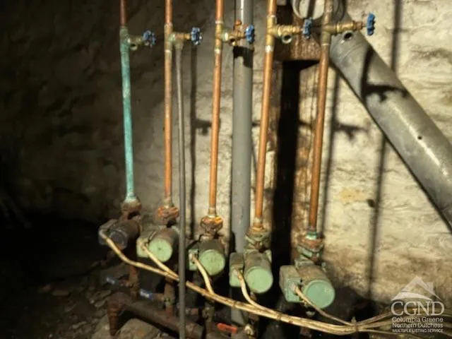 a bathroom with a granite countertop sink a mirror and a shower