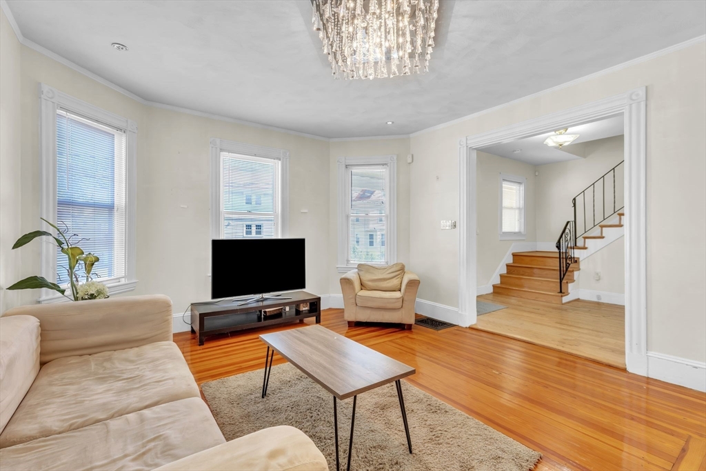 49 Laurel Street Watertown, MA 02472 - Photo 11 of 42 a living room with furniture and a flat screen tv