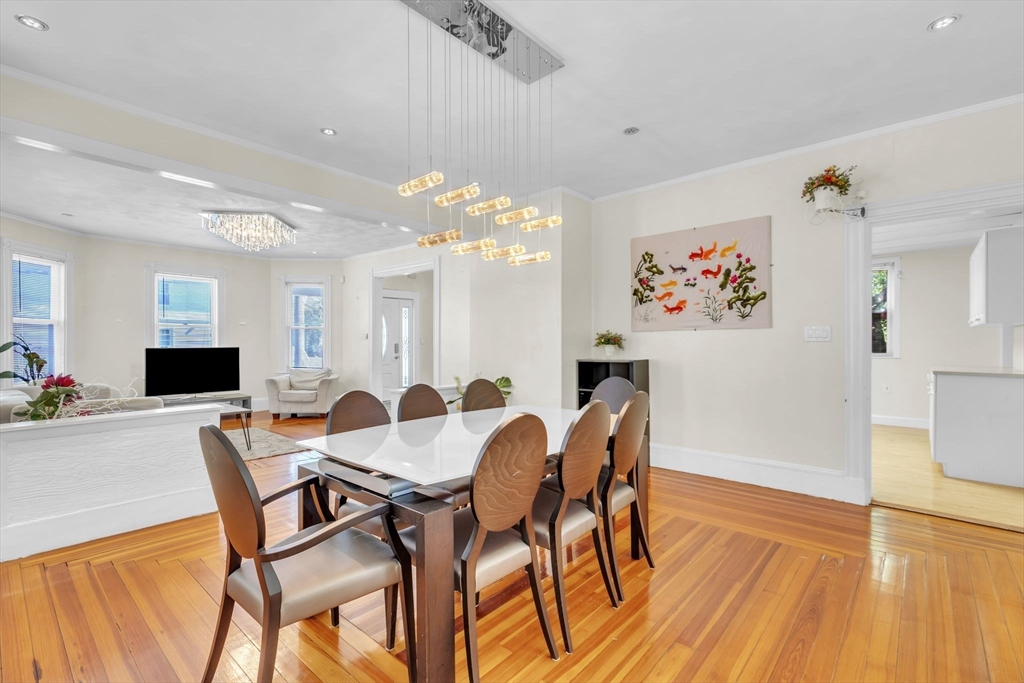 49 Laurel Street Watertown, MA 02472 - Photo 12 of 42 a view of a dining room with furniture and wooden floor