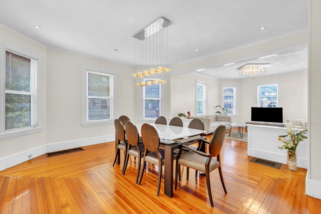 49 Laurel Street Watertown, MA 02472 - Photo 13 of 42 a view of a dining room with furniture and wooden floor