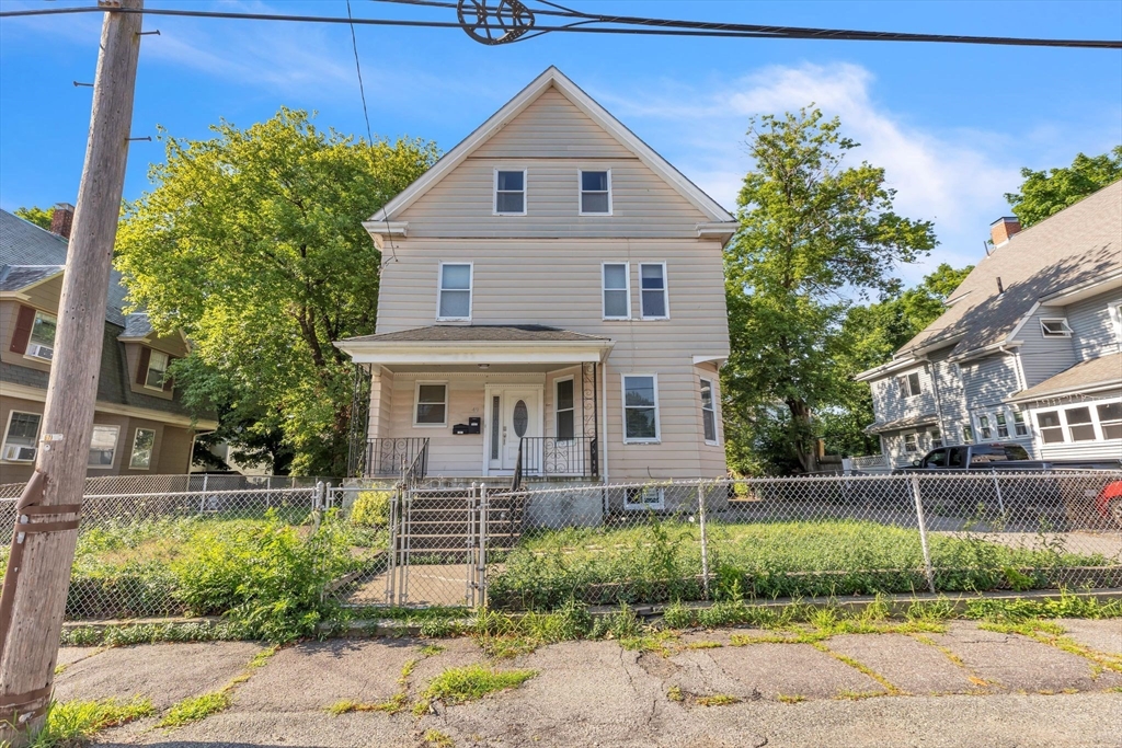 49 Laurel Street Watertown, MA 02472 - Photo 2 of 42 a front view of a house with garden