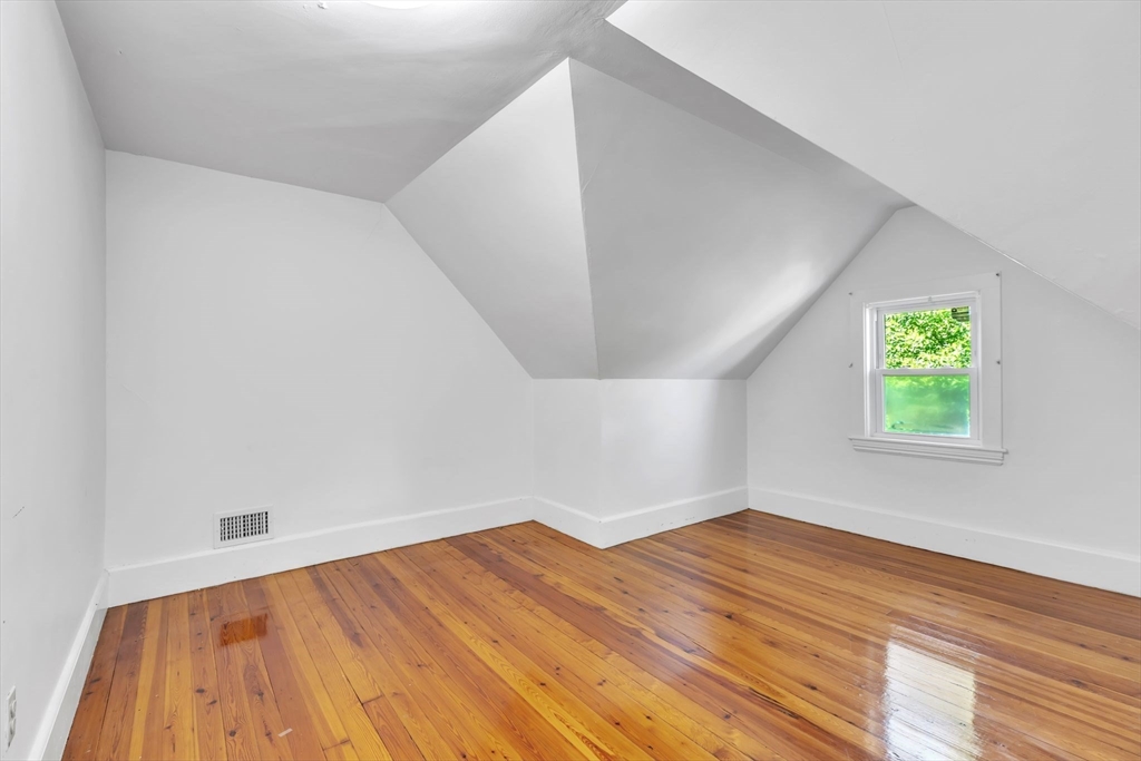 49 Laurel Street Watertown, MA 02472 - Photo 26 of 42 a view of empty room with wooden floor and fan