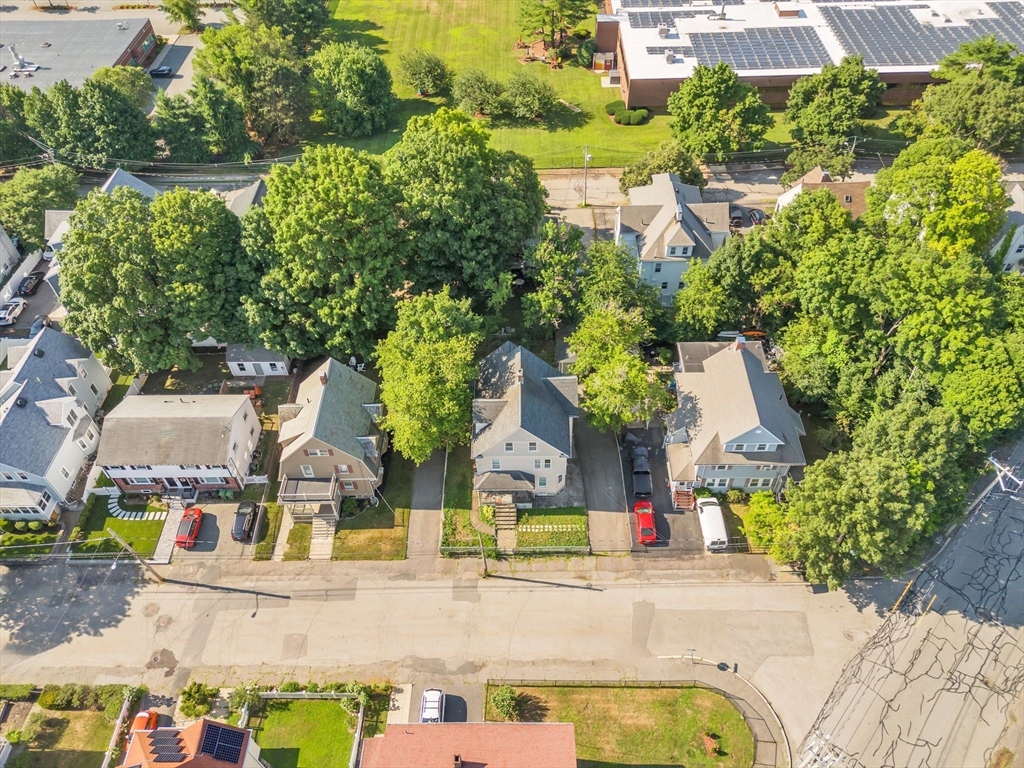 49 Laurel Street Watertown, MA 02472 - Photo 3 of 42 an aerial view of residential houses with outdoor space