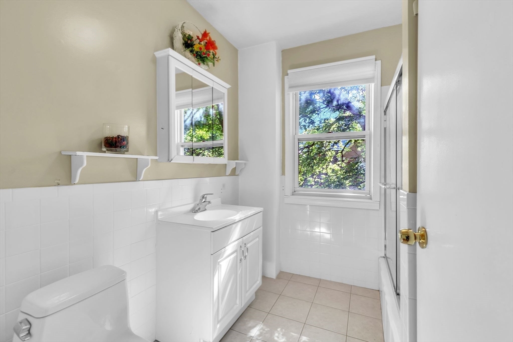 49 Laurel Street Watertown, MA 02472 - Photo 31 of 42 a bathroom with a sink a toilet and a bathtub