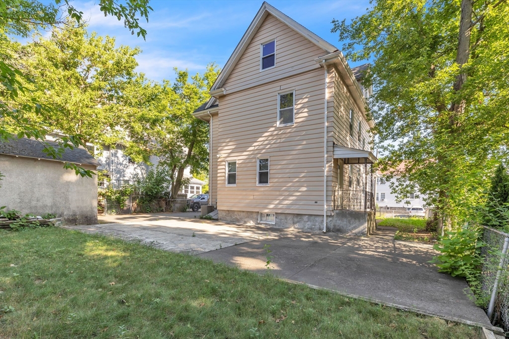 49 Laurel Street Watertown, MA 02472 - Photo 33 of 42 a view of a house with a yard